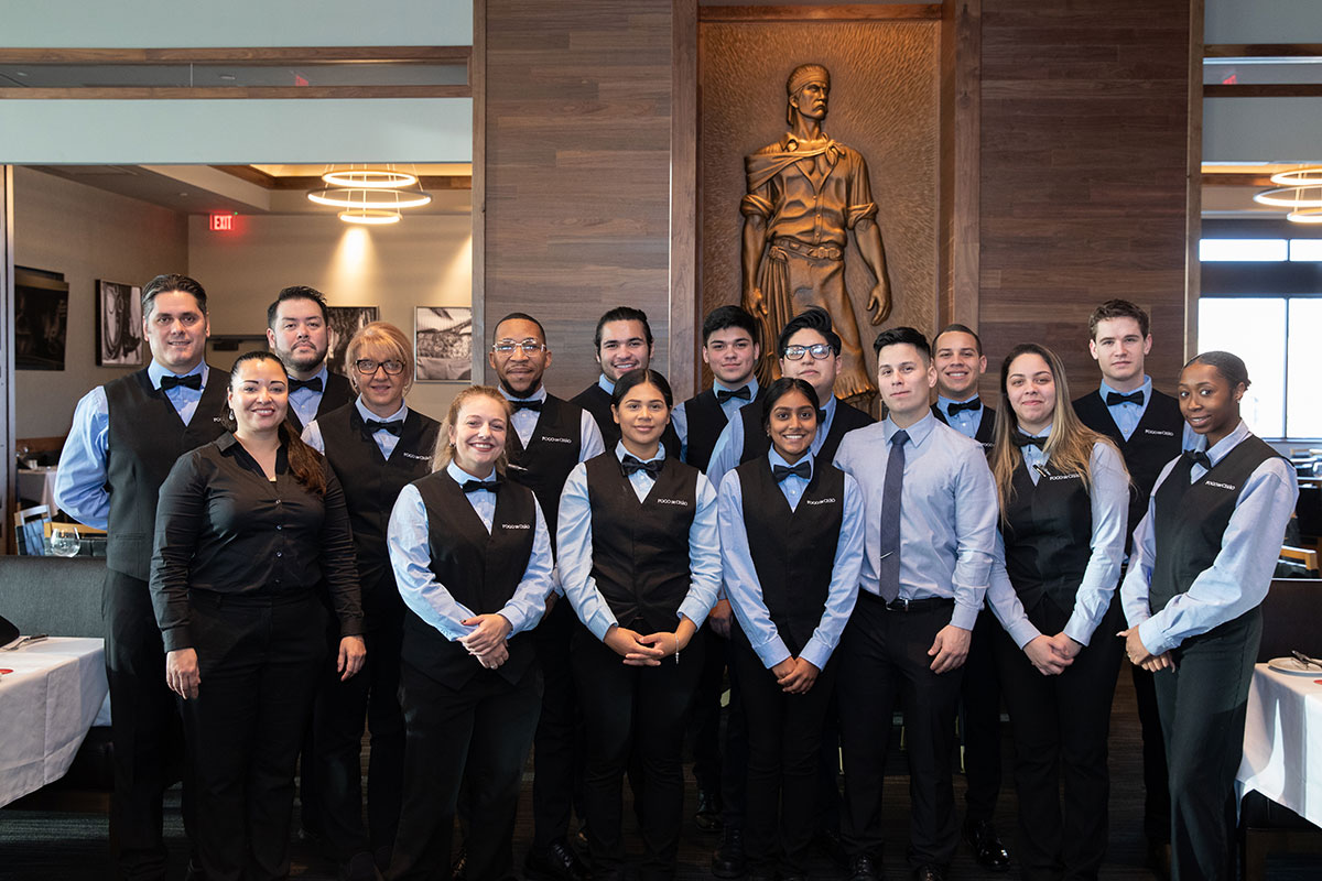 Wait staff and crew standing together