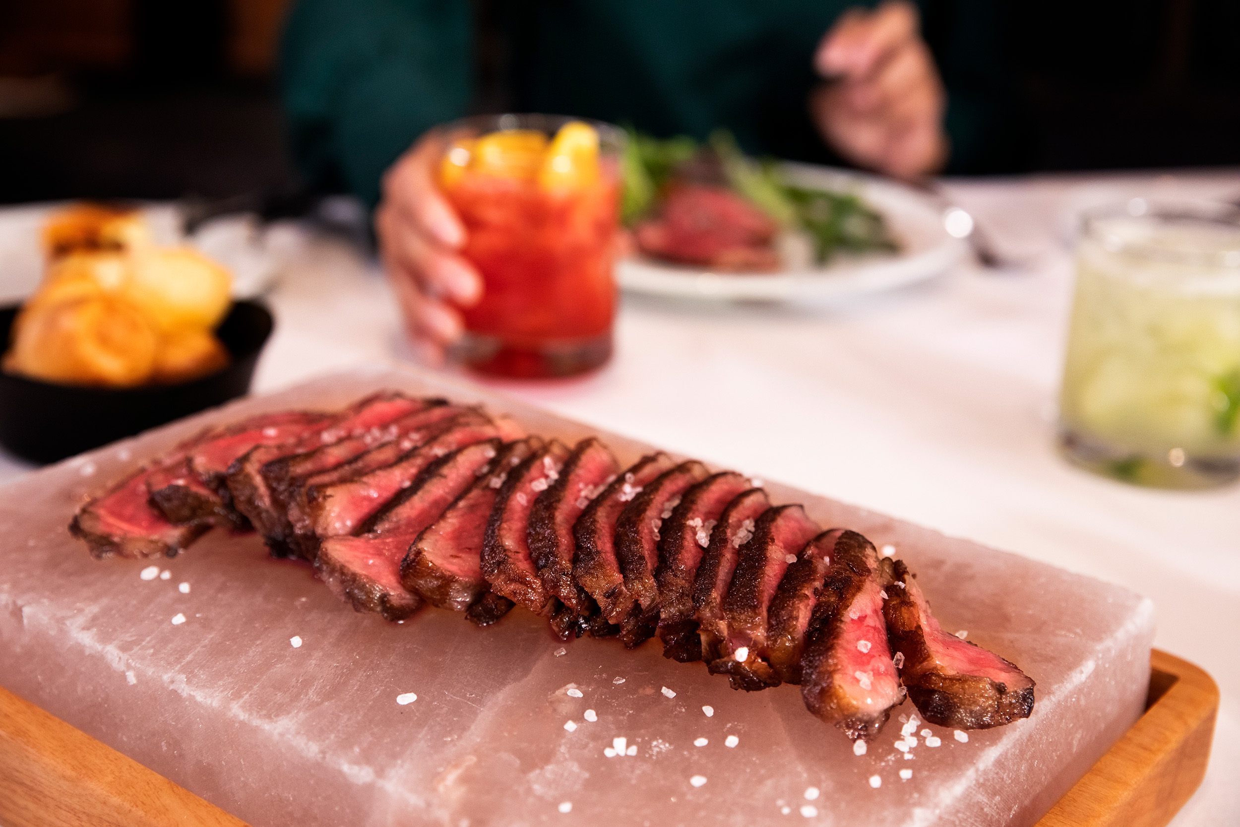 Wagyu strip steak on plank of salt